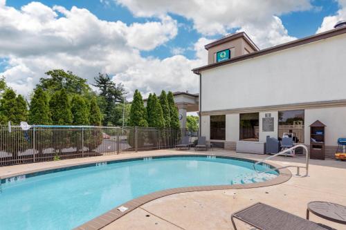 a swimming pool in front of a building at Quality Inn & Suites NJ State Capital Area in Morrisville