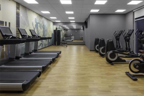 a gym with rows of treadmills and machines at Hyatt House The Woodlands-Shenandoah in Shenandoah