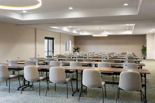 a large room with tables and chairs in it at Wyndham Garden Newark Fremont Silicon Valley in Newark