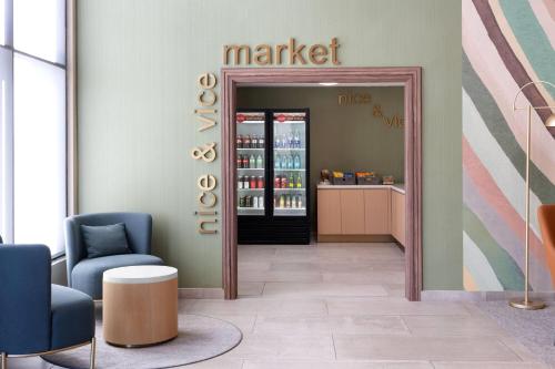 a store with a market sign on the wall in a room at Wyndham Garden Newark Fremont Silicon Valley in Newark