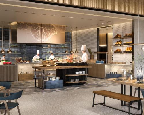 a restaurant with chefs preparing food in a kitchen at Hyatt Place Ha Long Bay, Bai Chay in Ha Long