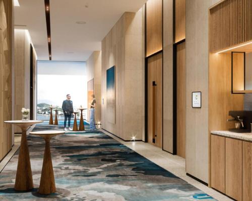 a hallway of a hotel with a large rug at Hyatt Place Ha Long Bay, Bai Chay in Ha Long