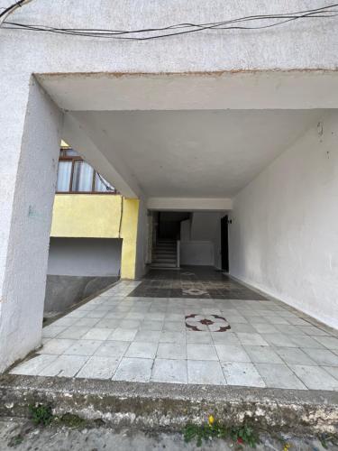 an empty hallway of a building with a number on the floor at Newly renovated 1 bedroom Flat in Tepelenë in Tepelenë