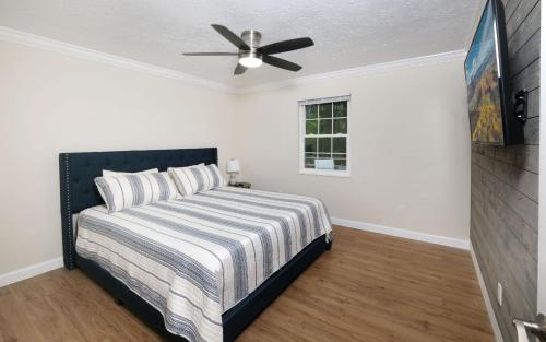 a bedroom with a bed and a ceiling fan at Whiskey Ridge in Sevierville