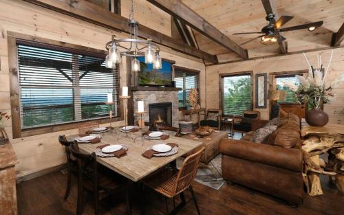 a living room with a table and a couch at Chestnut Bearadise in Gatlinburg