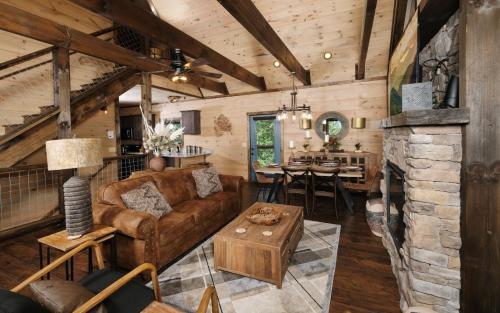 a living room with a couch and a table at Chestnut Bearadise in Gatlinburg