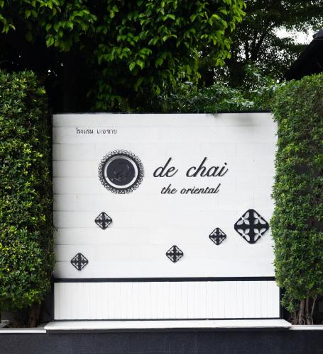 a sign that says do chan the original at De Chai Oriental Nimman - SHA Plus in Chiang Mai