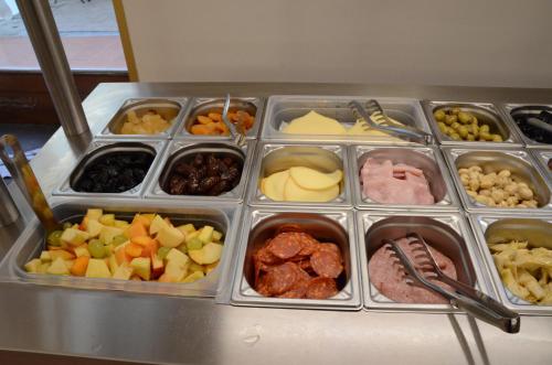 a tray filled with different types of food at Hotel Mia Cara & Spa in Florence