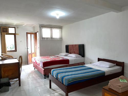 Postel nebo postele na pokoji v ubytování Hotel Pison
