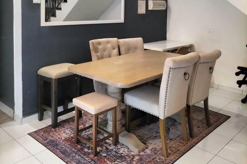 a dining room table and chairs in a room at Iris 32 3BR Corner Lot Wi-fi Mutiara Rini Skudai JB Malay Only in Johor Bahru