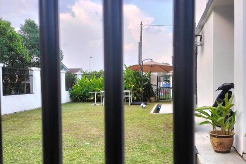 a view from a window of a yard with a playground at Iris 32 3BR Corner Lot Wi-fi Mutiara Rini Skudai JB Malay Only in Johor Bahru
