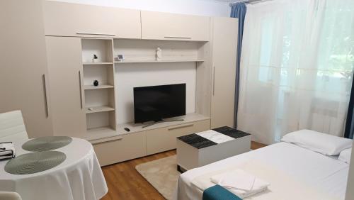 Ένα ή περισσότερα κρεβάτια σε δωμάτιο στο Apartament 2 camere