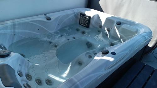 a blue bath tub sitting in a bathroom at La Tartana in Castro di Lecce