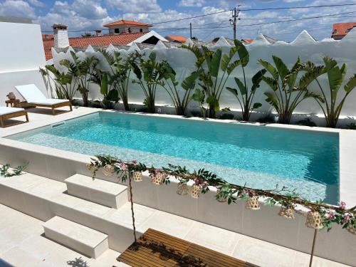 a swimming pool on the roof of a building at Villa Rafa in Costa Nova