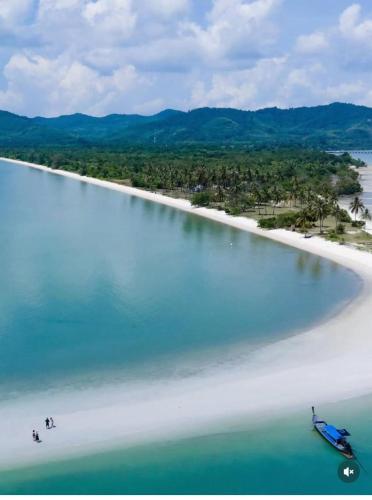 an aerial view of a beach with a boat in the water at Better View Koh Yao Yai in Ko Yao Yai