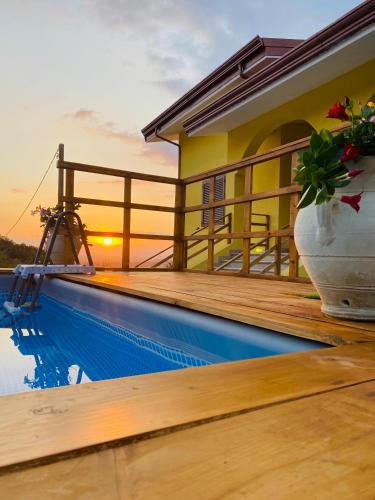 a villa with a swimming pool and a house at Relais Green Paradise in Apice