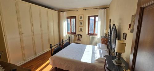 a bedroom with a bed in a room at La Terrazza 2P Rooms in Abbadia San Salvatore