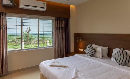 Postel nebo postele na pokoji v ubytování La Vue Resort