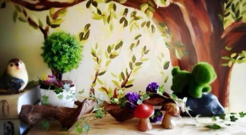 a group of plants and flowers on a table at Spring Flowers Blossoming Hotel in Yangshuo