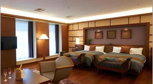 Ένα ή περισσότερα κρεβάτια σε δωμάτιο στο Hotel Kawakyu