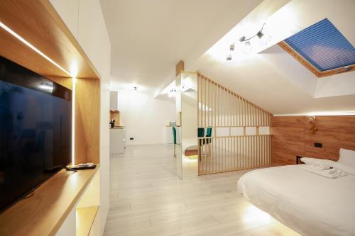 Μια τηλεόραση ή/και κέντρο ψυχαγωγίας στο Prestige Suites - Cluj Luxury