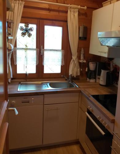 a kitchen with a sink and a window at Naturerlebnisdorf Stamsried 3 in Stamsried