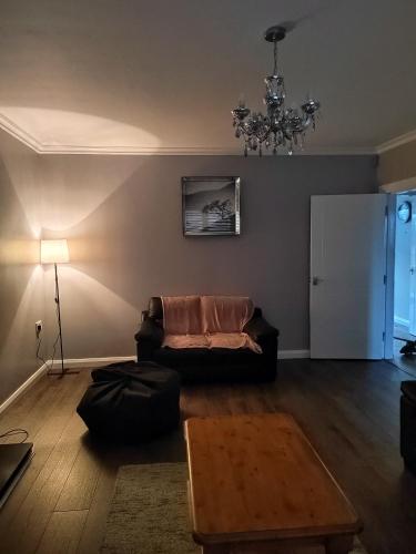 a living room with a couch and a table at Teach Abhaile Donegal 