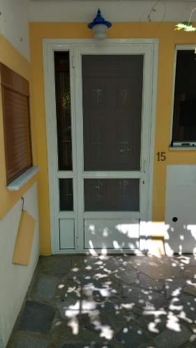 a front door of a house with the number at Apartments Zafiria in Ágios Konstantínos