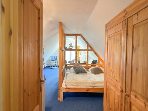 Ένα ή περισσότερα κρεβάτια σε δωμάτιο στο Ferienanlage "Uns Wiek Hus" Ferienwohnung 7