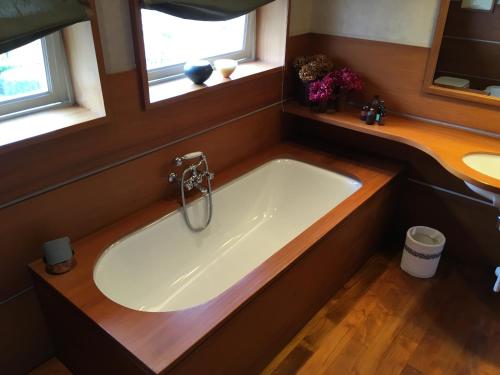 a bath tub in a bathroom with a window at Suite 52 in Naples
