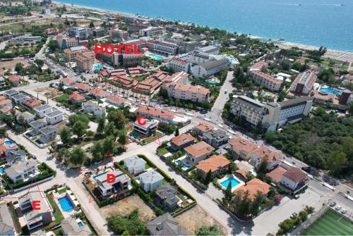 an aerial view of a city with buildings and the ocean at Camyuva Beach Hotel in Kemer