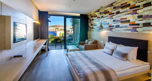 Кровать или кровати в номере Costa Farilya Special Class Hotel Bodrum
