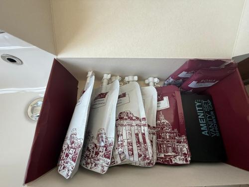 a box filled with books and toothbrushes at Hotel Ottaviano Augusto in Rome