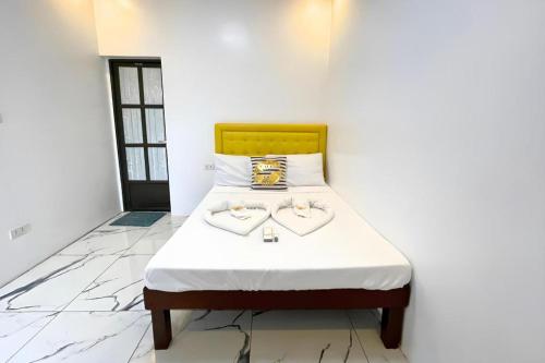 a bedroom with a bed with two hearts on it at Pilot Hotel in Alaminos