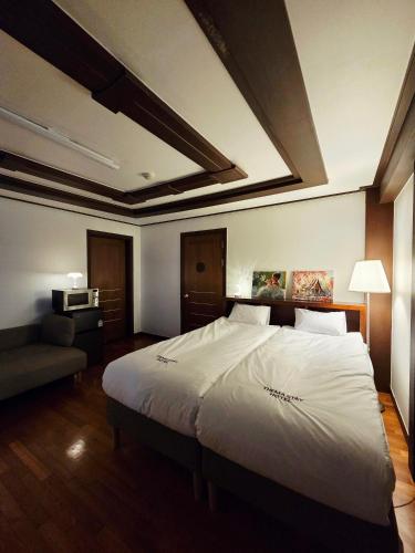 Ένα ή περισσότερα κρεβάτια σε δωμάτιο στο Thema Stay Hotel
