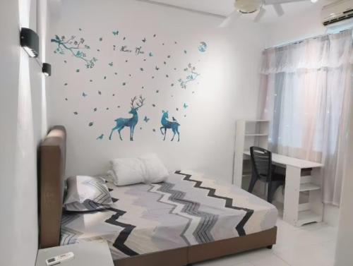 a bedroom with a bed with blue stars on the wall at Comfy Room Near to Penang Bridge in George Town