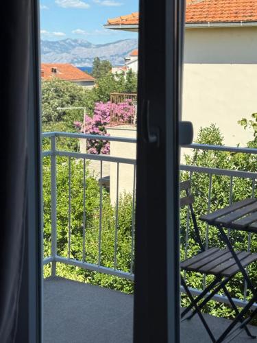 a view from a window of a balcony at Bed & Breakfast Kurtic in Supetar