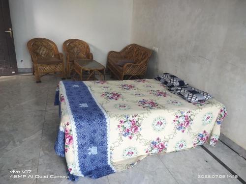 Postel nebo postele na pokoji v ubytování Vishal Homestay