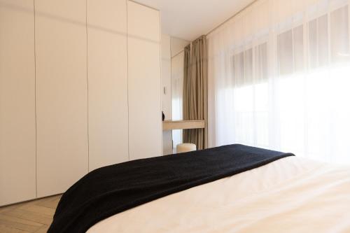 Katil atau katil-katil dalam bilik di Royalton Suites