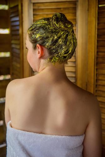 a woman in a white dress with her hair at Summerfields Rose Retreat and Spa in Hazyview