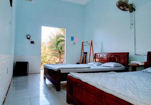 Katil atau katil-katil dalam bilik di Farmstay Đảo Xanh