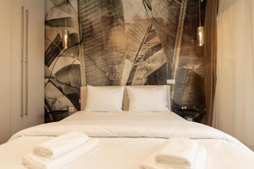 Katil atau katil-katil dalam bilik di Royalton Suites