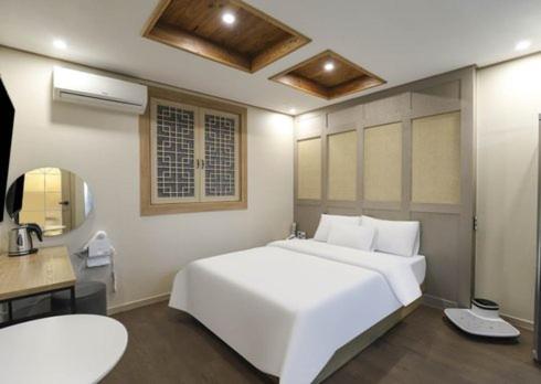 Katil atau katil-katil dalam bilik di Heoandjang Hanok Hotel