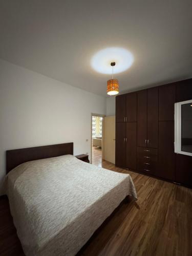 a bedroom with a large bed and a light at Villa Machiavelli in Draçi