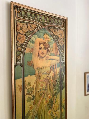 a painting of a woman on a wall at Grand Hotel Loutraki in Loutraki