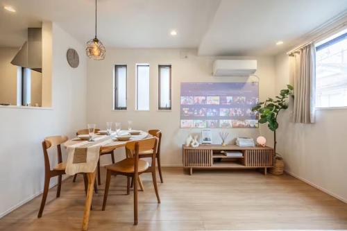 a dining room with a table and chairs at Skytree View! Modern Entire House in Tokyo in Tokyo