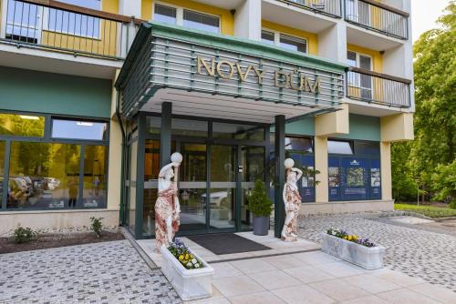 two mannequins in front of a new firm building at Spa Resort Libverda - Hotel Nový Dům in Lázně Libverda