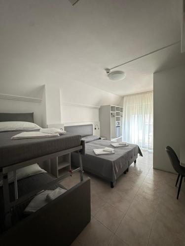 Postel nebo postele na pokoji v ubytování Hotel DOLCEVITA Park & Beach included