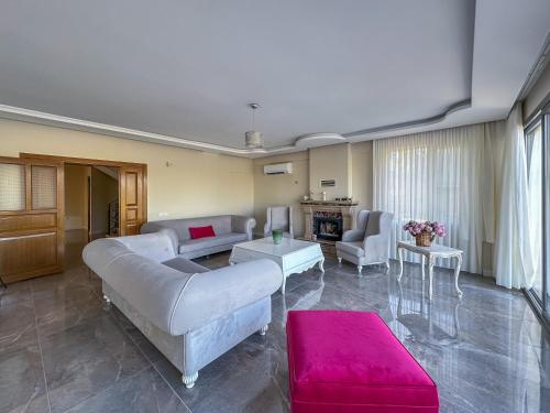 a living room with a couch and a table at Urla Villa in Urla