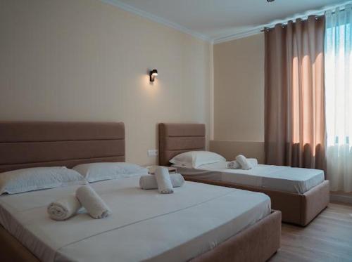 Postel nebo postele na pokoji v ubytování OKEJ Hotel